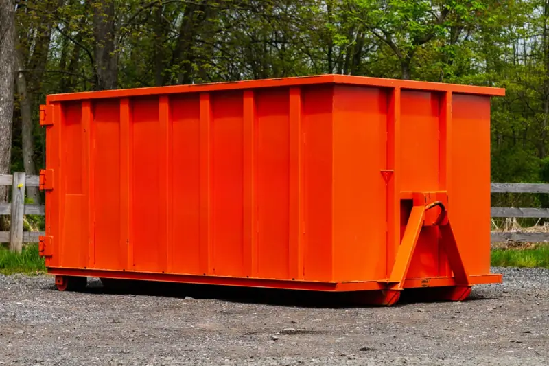 Steel dumpster on gravel