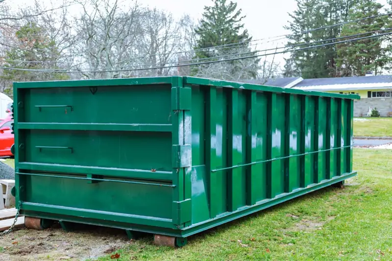 Large roll-off dumpster on a lot